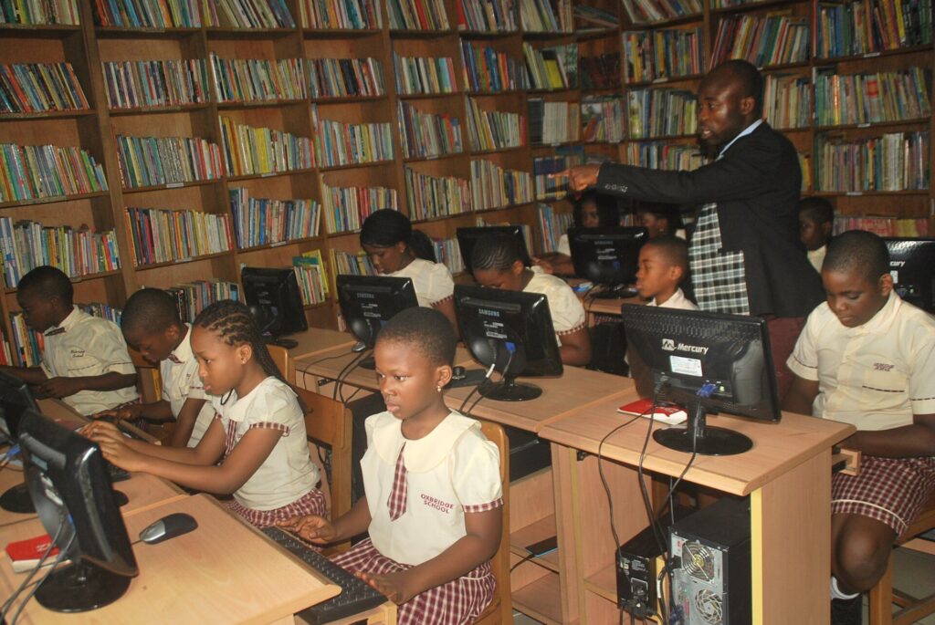 Pupils working at computers in a Nigerian school computer room