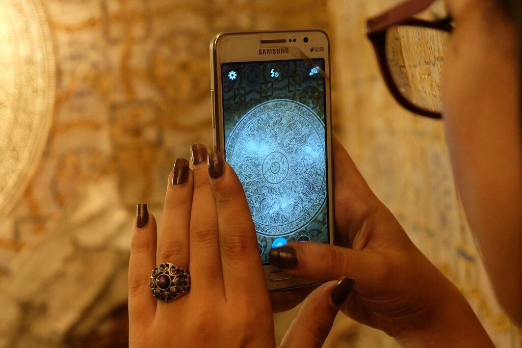 Someone paying a bill on their phone with the Gap Castle app