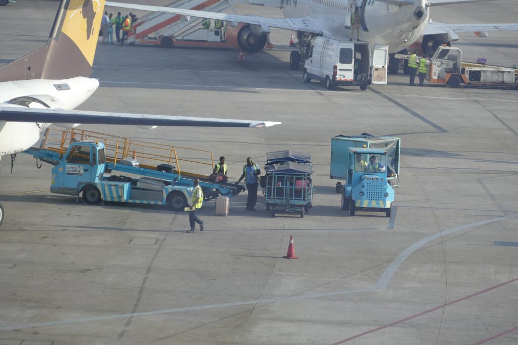Ground crew loading an aircraft on the tarmac at a Nigerian airport